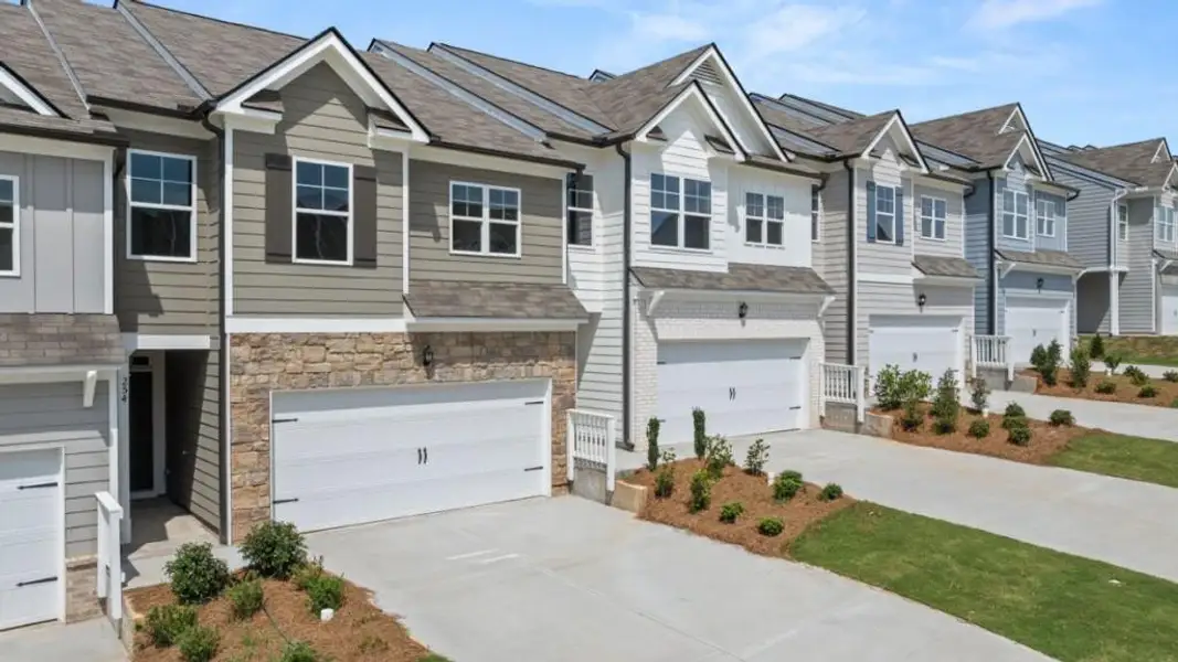 Front exterior of a new home in Rolling Meadows, Jasper, GA, highlighting curb appeal (Image 2). Front exterior of a new home in Rolling Meadows, Jasper, GA, highlighting curb appeal (Image 2).