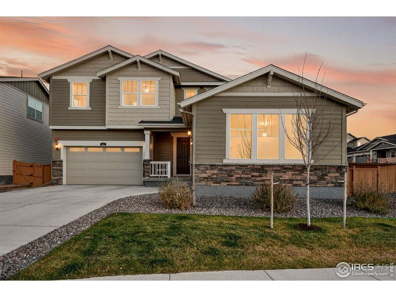 Front exterior of a new home in Sunset Village, Erie, CO, highlighting curb appeal (Image 1). Front exterior of a new home in Sunset Village, Erie, CO, highlighting curb appeal (Image 1).
