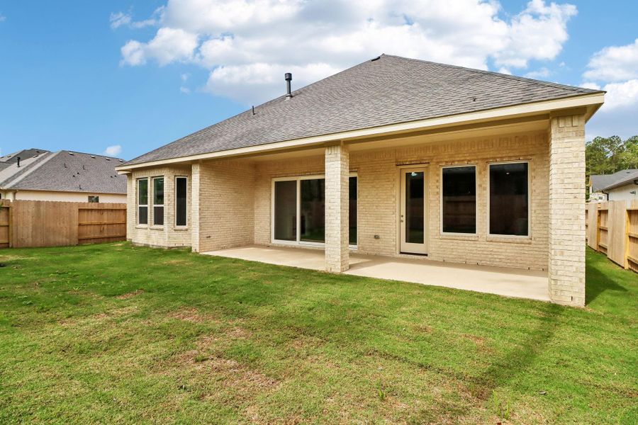 Exterior details and patio area of a home in Woodhavyn 60', Magnolia (Image 3).