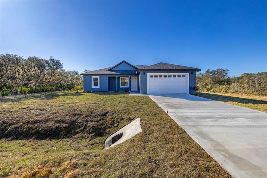 Front exterior of a new home in , Avon Park, FL, highlighting curb appeal (Image 20). Front exterior of a new home in , Avon Park, FL, highlighting curb appeal (Image 20).