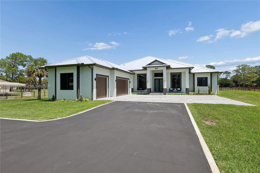 Front exterior of a new home in , Naples, FL, highlighting curb appeal (Image 22).