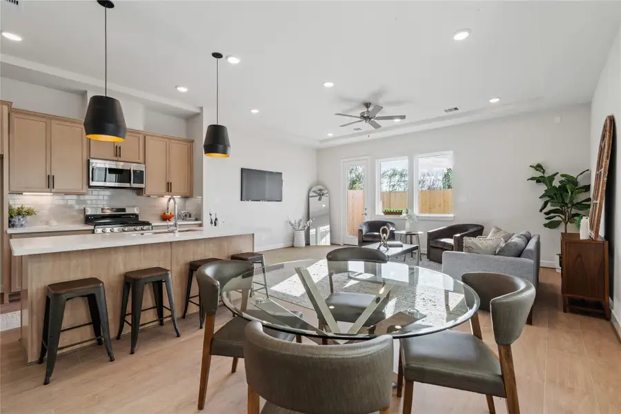 The open layout connects kitchen, dining, and living so the whole first floor flows together without feeling forced. The open layout connects kitchen, dining, and living so the whole first floor flows together without feeling forced.