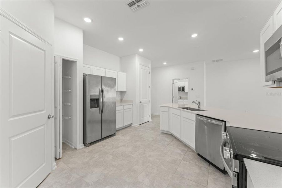 Furnished interior view inside a new home in Peace Creek Reserve, Winter Haven (Image 8).