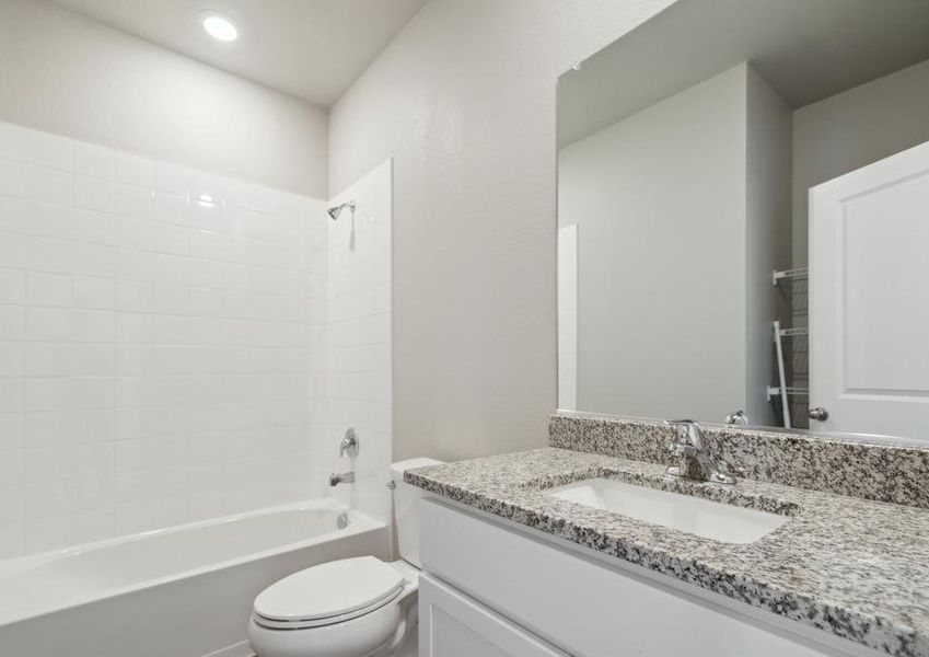 The secondary bathroom has a tub shower combo.