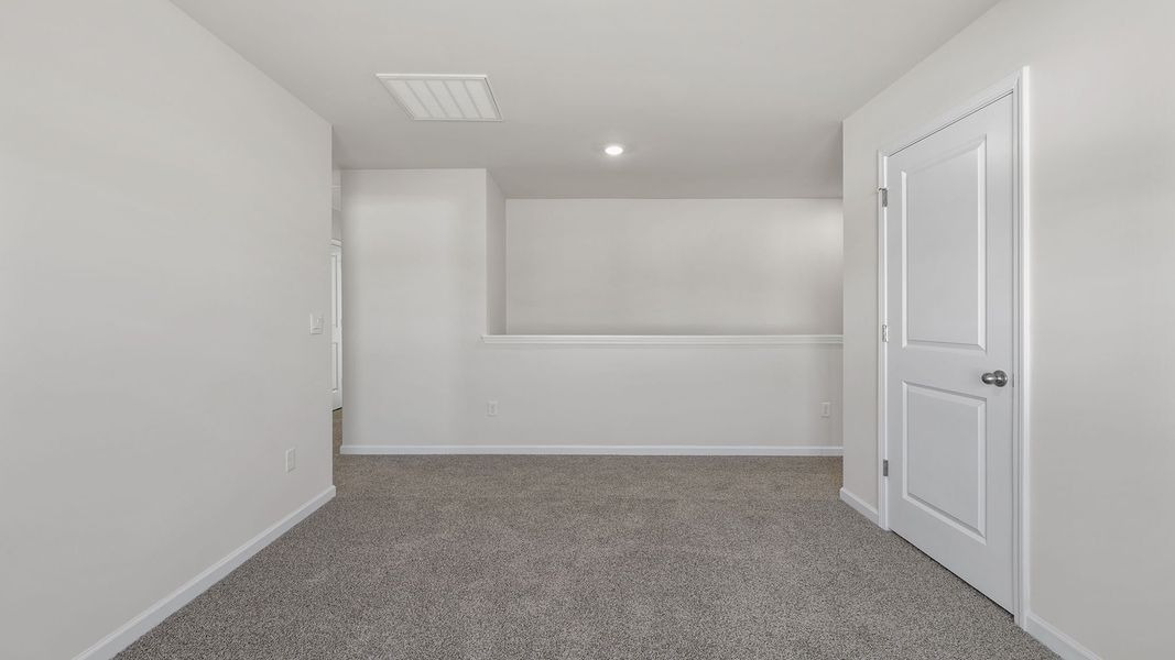 Spacious, unfurnished interior of a new home in Bentley Park, Greenwood (Image 24).