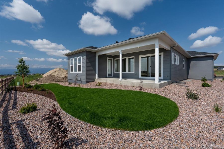 Front exterior of a new home in Wolf Ranch - Enclave Collection, Colorado Springs, CO, highlighting curb appeal (Image 1).