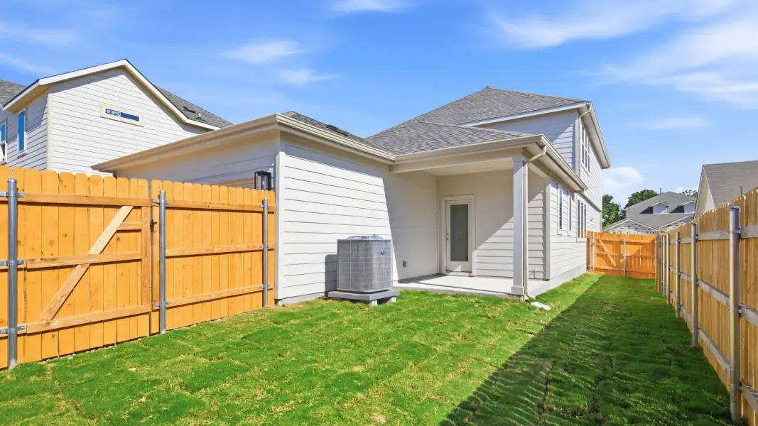 Exterior details and patio area of a home in Creeks Crossing, Elgin (Image 23).