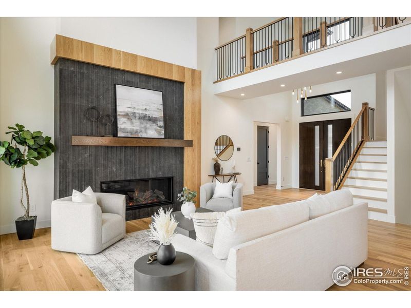 Gorgeous signature fireplace surround brings multiple finishes and textures into the overall design and feel of this open concept Great Room