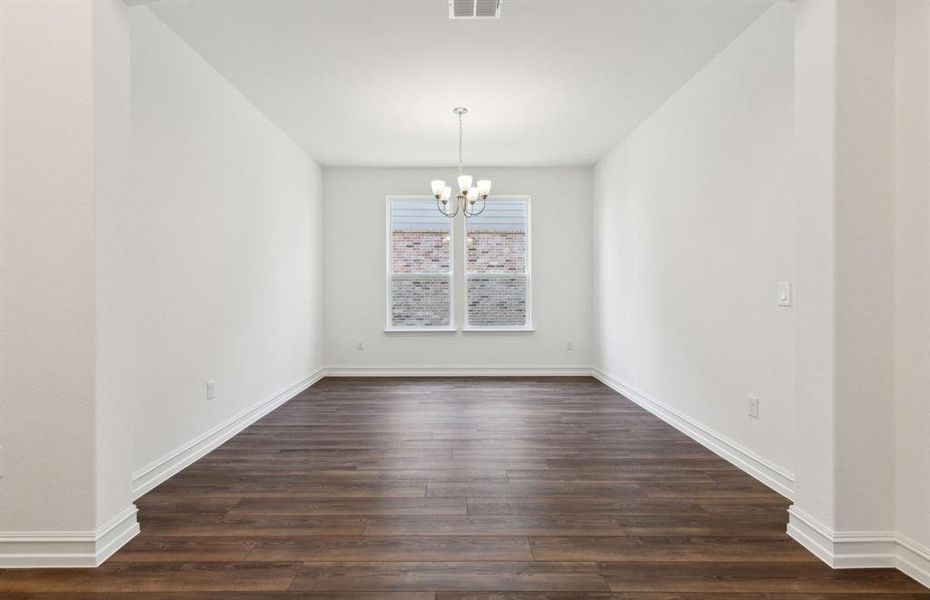 Sunlit dining room with large windows *real home pictured