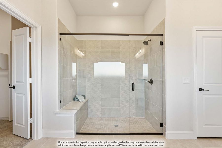 Walk-in shower with glass door, herringbone tile walls, built-in bench, and dual shower niches Walk-in shower with glass door, herringbone tile walls, built-in bench, and dual shower niches
