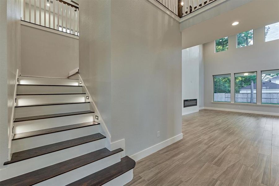 The stairway is illuminated with soft lighting, creating a beautiful path at night.