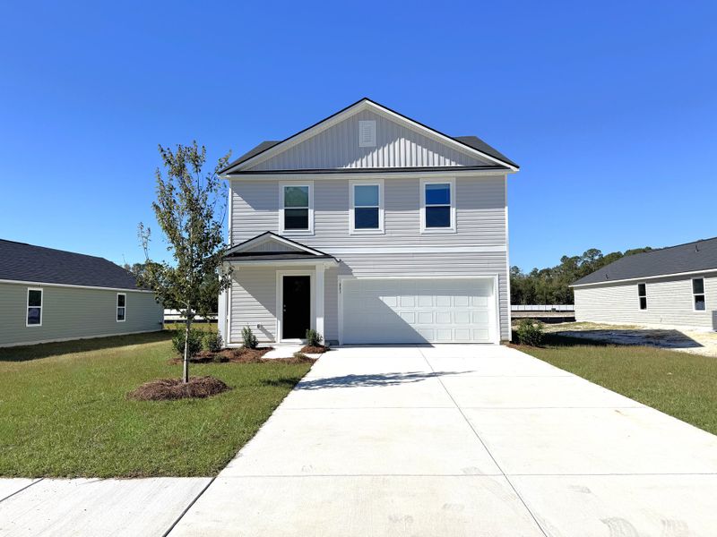 Front exterior of a new home in Birchwood, Longs, SC, highlighting curb appeal (Image 1).