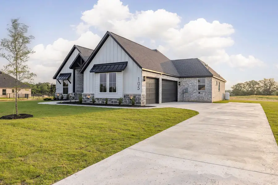 Front exterior of a new home in Prairie Winds Estates, Poolville, TX, highlighting curb appeal (Image 2). Front exterior of a new home in Prairie Winds Estates, Poolville, TX, highlighting curb appeal (Image 2).