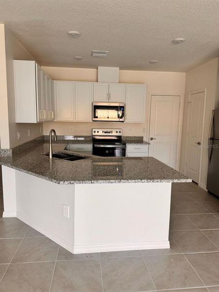 Furnished interior view inside a new home in , Davenport (Image 6).