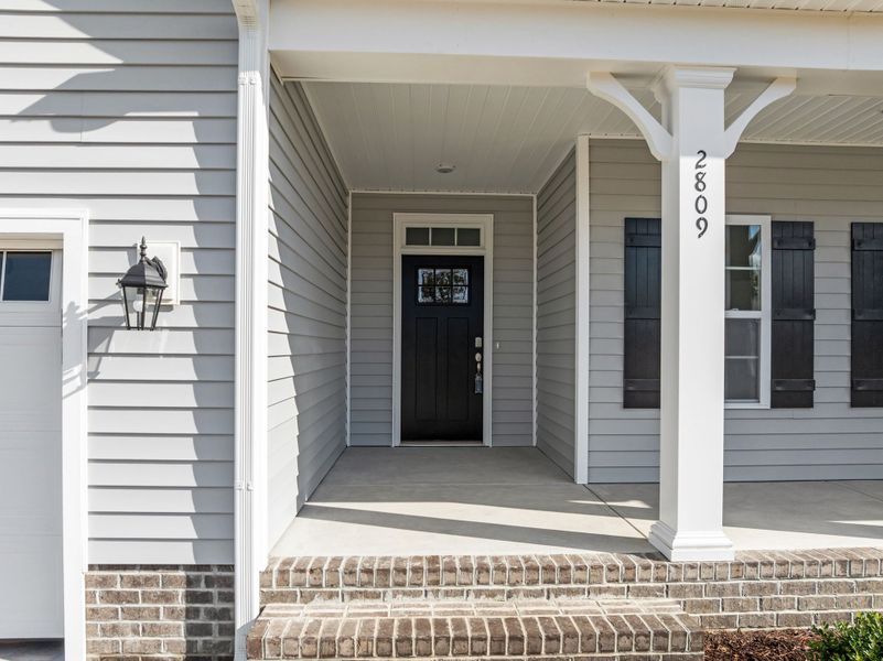 Exterior details and patio area of a home in The Preserve at Langston, Winterville (Image 4). Exterior details and patio area of a home in The Preserve at Langston, Winterville (Image 4).