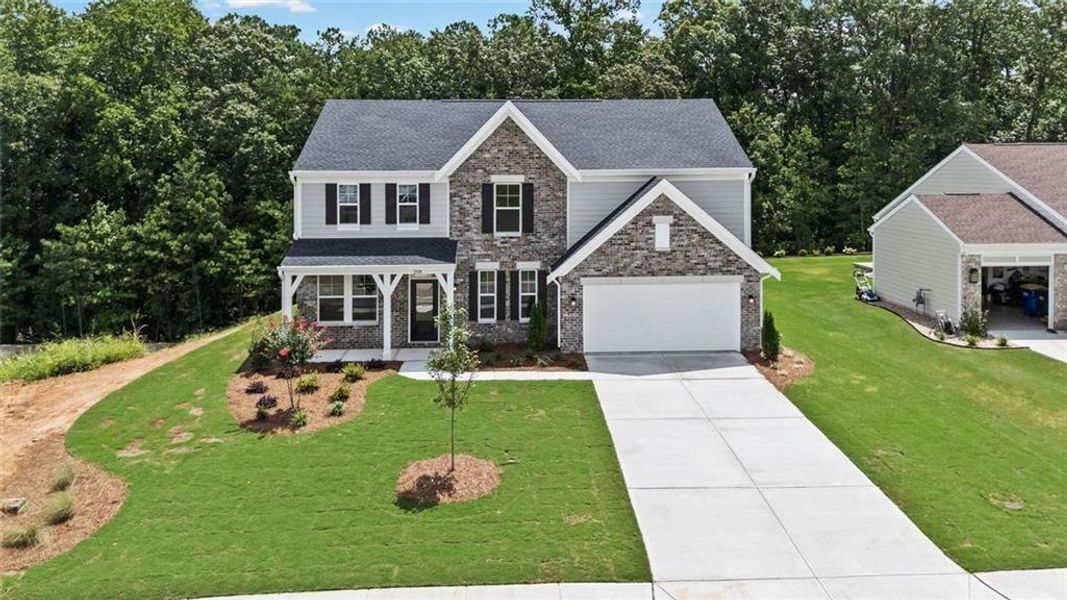 Front exterior of a new home in Pickens Bluff, Dallas, GA, highlighting curb appeal (Image 19).