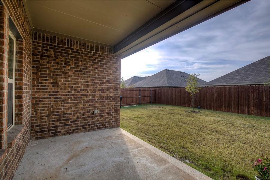 Fenced backyard featuring a patio area