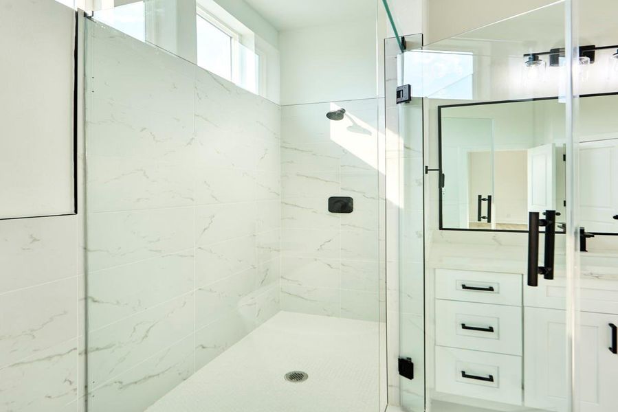 Pamper yourself in this luxurious primary bathroom complete with a separate soaking tub and a glass-enclosed walk-in shower. A tranquil retreat with contemporary finishes, it’s the ideal space to unwind. Pamper yourself in this luxurious primary bathroom complete with a separate soaking tub and a glass-enclosed walk-in shower. A tranquil retreat with contemporary finishes, it’s the ideal space to unwind.