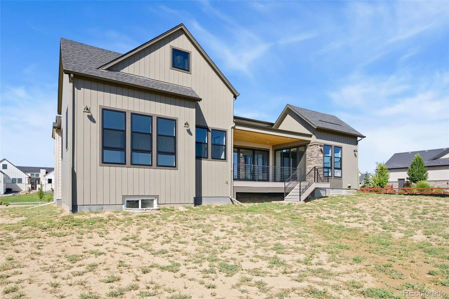 Front exterior of a new home in Acadia at RainDance, Windsor, CO, highlighting curb appeal (Image 17).