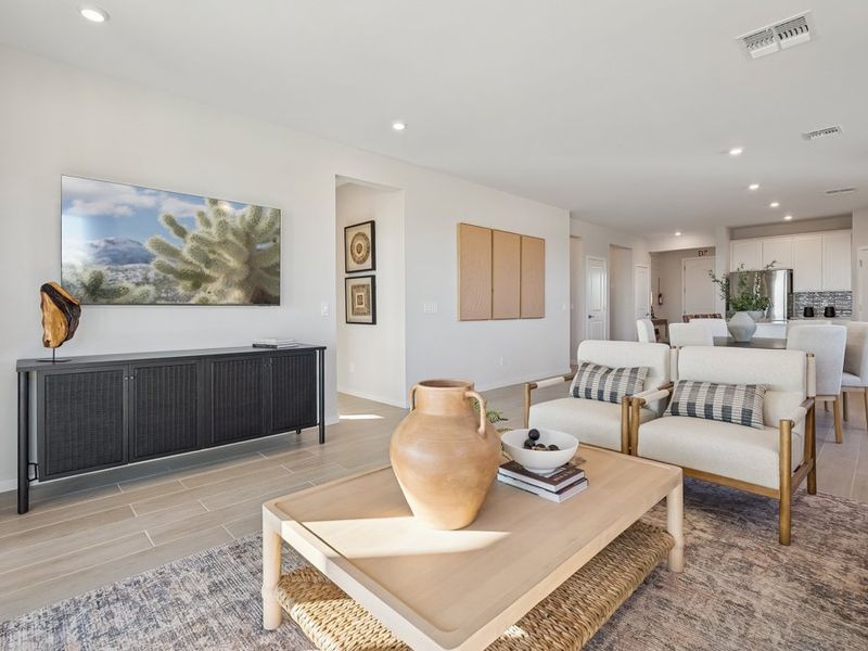 A living room with a large painting.