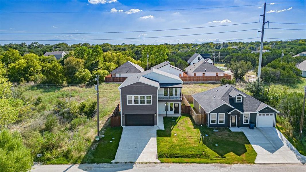 Front exterior of a new home in , Granbury, TX, highlighting curb appeal (Image 23). Front exterior of a new home in , Granbury, TX, highlighting curb appeal (Image 23).