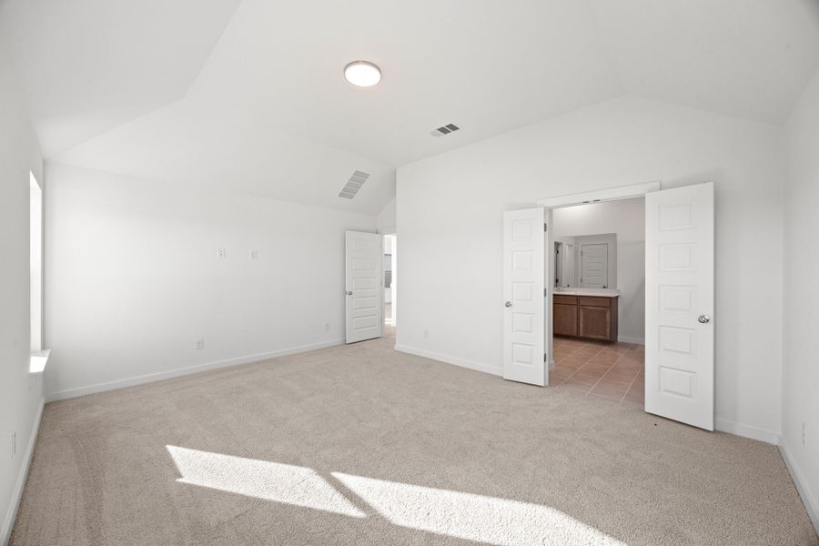Primary Bedroom in the Turquoise home plan by Trophy Signature Homes – REPRESENTATIVE PHOTO