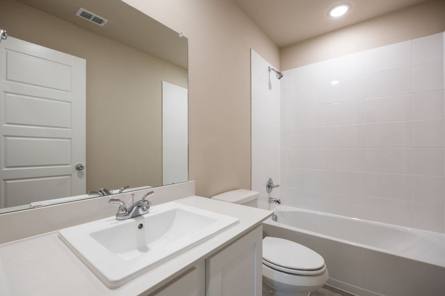 Bathroom in the Harper home plan by Trophy Signature Homes – REPRESENTATIVE PHOTO