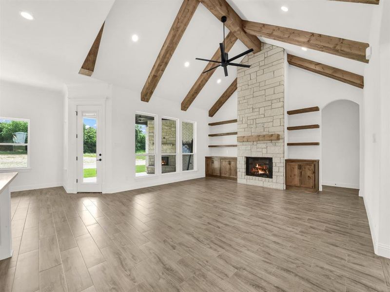 Kitchen with a sink, a ceiling fan, a center island with sink, recessed lighting, and a fireplace Kitchen with a sink, a ceiling fan, a center island with sink, recessed lighting, and a fireplace