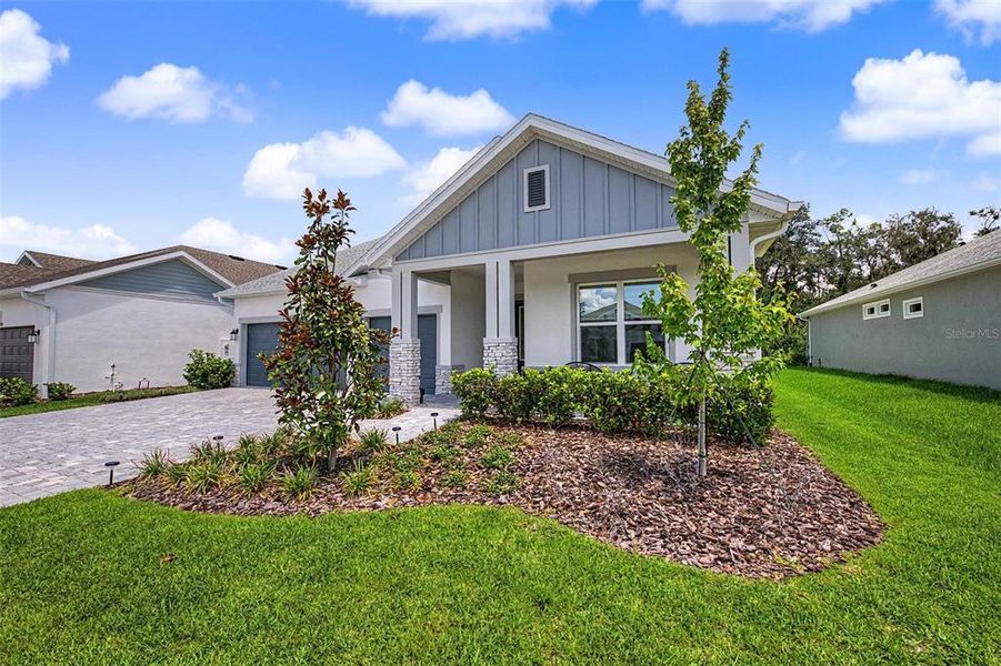 Front exterior of a new home in , Wesley Chapel, FL, highlighting curb appeal (Image 22). Front exterior of a new home in , Wesley Chapel, FL, highlighting curb appeal (Image 22).