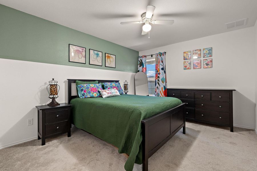 Spacious primary bedroom with a calming atmosphere. Spacious primary bedroom with a calming atmosphere.