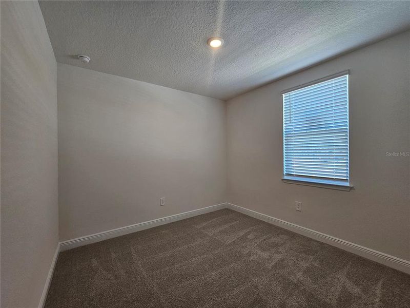 Spacious, unfurnished interior of a new home in The Reserve at Hammock Oaks - Signature Series, Lady Lake (Image 30).