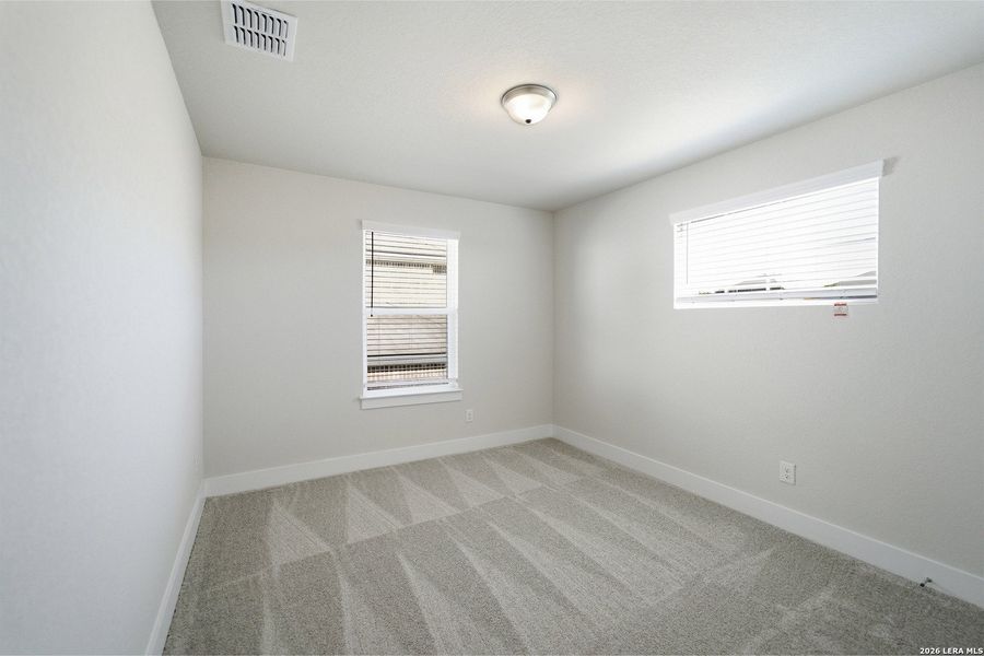 Spacious, unfurnished interior of a new home in The Woodlands at Medina Hills, Mico (Image 22).