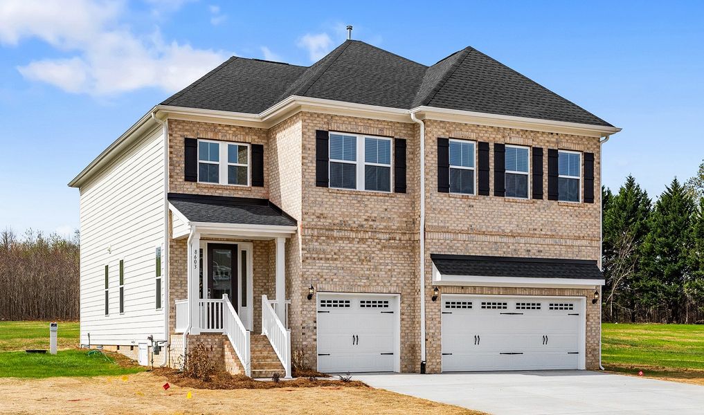 Front exterior of a new home in Lilah Grove, Summerfield, NC, highlighting curb appeal (Image 21).