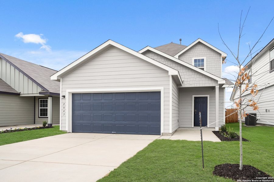 Front exterior of a new home in Dauer Ranch, New Braunfels, TX, highlighting curb appeal (Image 2). Front exterior of a new home in Dauer Ranch, New Braunfels, TX, highlighting curb appeal (Image 2).