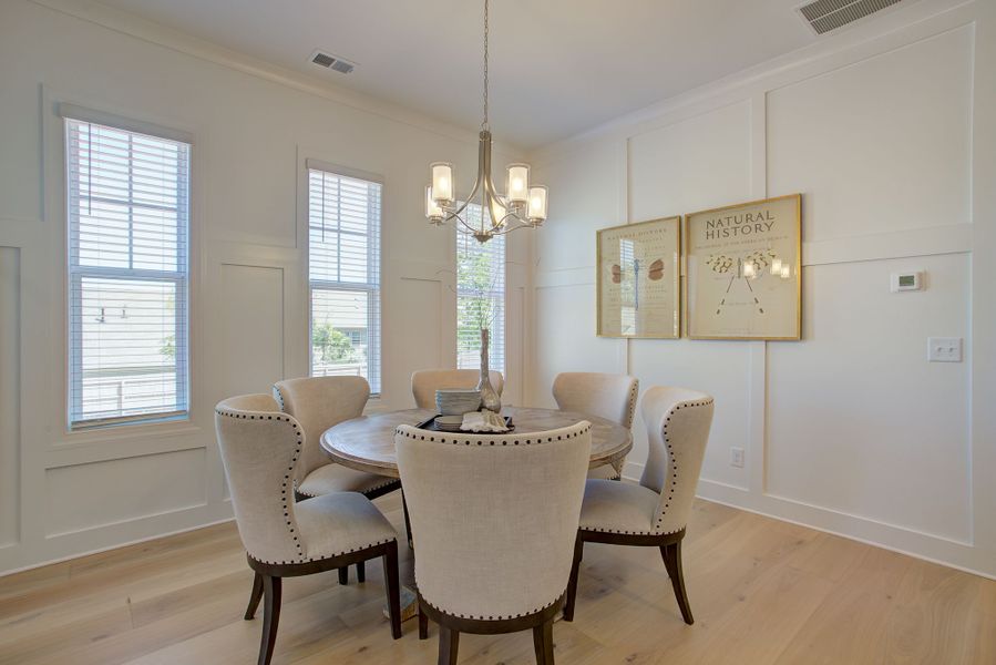 The inviting foyer opens into the formal dining room