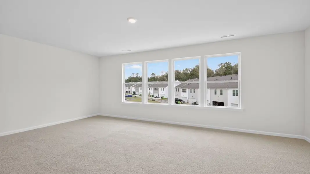Spacious, unfurnished interior of a new home in The Townes at Anderson Farm, Wendell (Image 26).