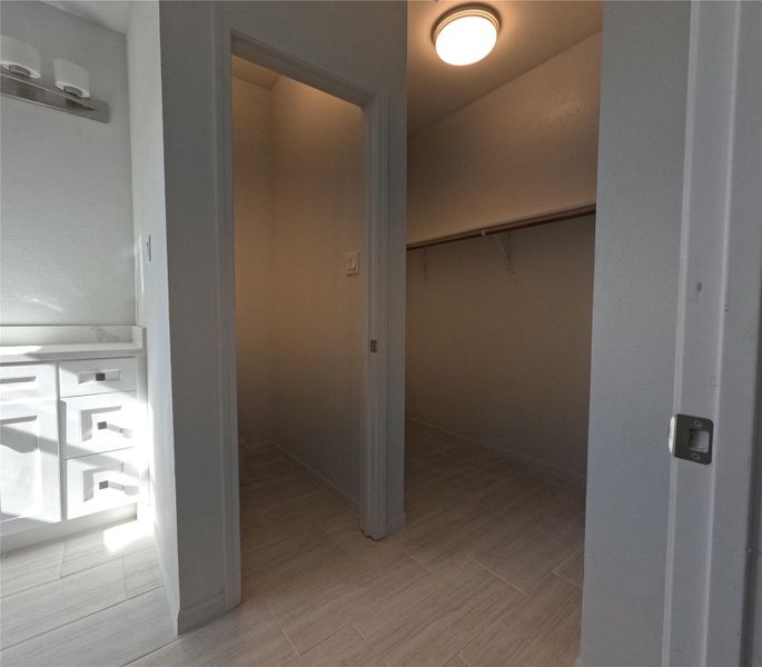 Toilet and walk-in closet from doorway