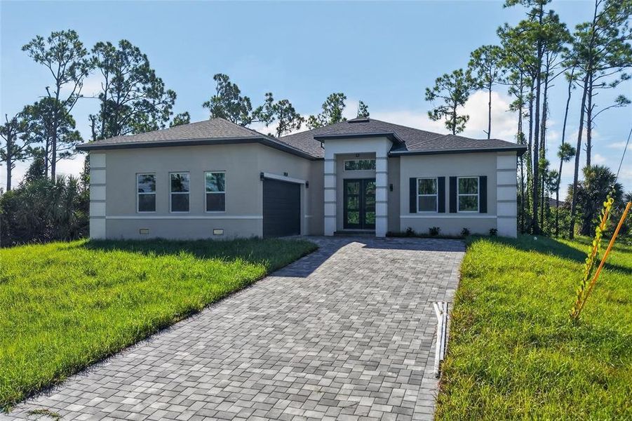 Front exterior of a new home in , Port Charlotte, FL, highlighting curb appeal (Image 24).