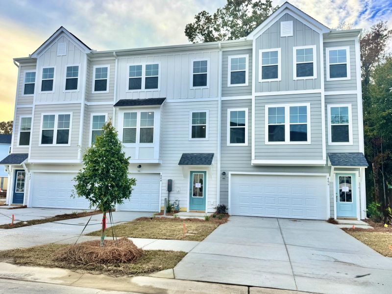 Front exterior of a new home in Indigo Grove Townhomes, Johns Island, SC, highlighting curb appeal (Image 1).