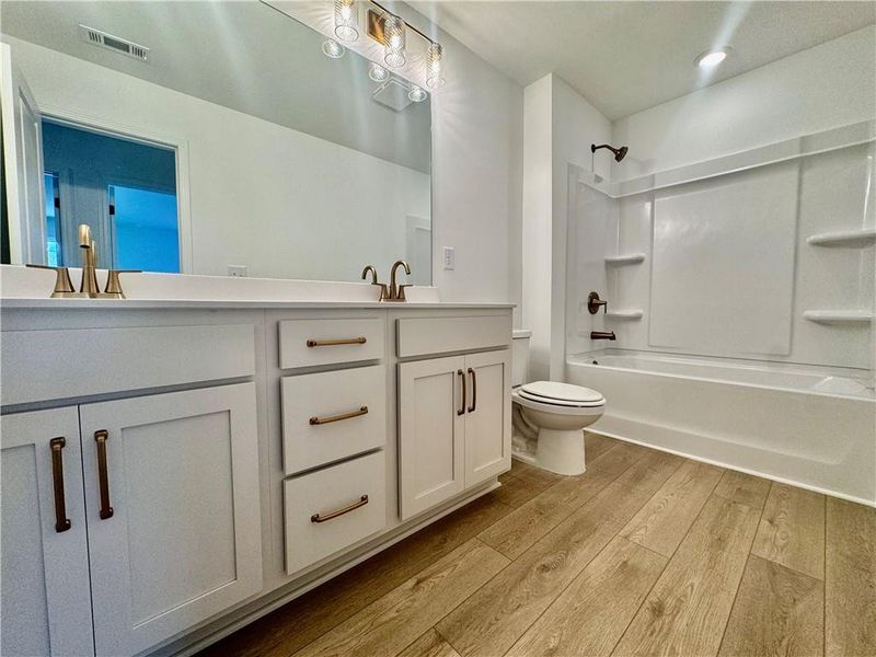 Furnished interior view inside a new home in Eastlyn Crossing, Flowery Branch (Image 11).