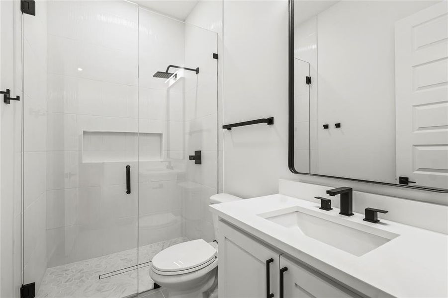 Bathroom featuring vanity and a stall shower