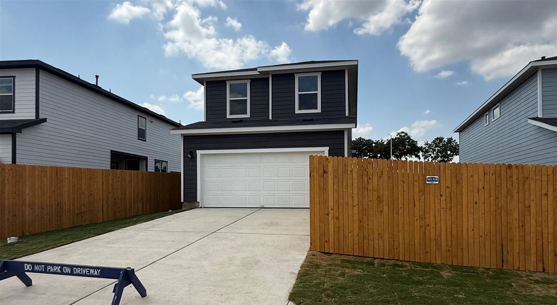 Front exterior of a new home in Valverde, Bastrop, TX, highlighting curb appeal (Image 5). Front exterior of a new home in Valverde, Bastrop, TX, highlighting curb appeal (Image 5).
