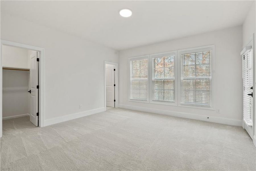 Roomy secondary bedrooms with direct access to the covered porch on top floor! Not actual home.