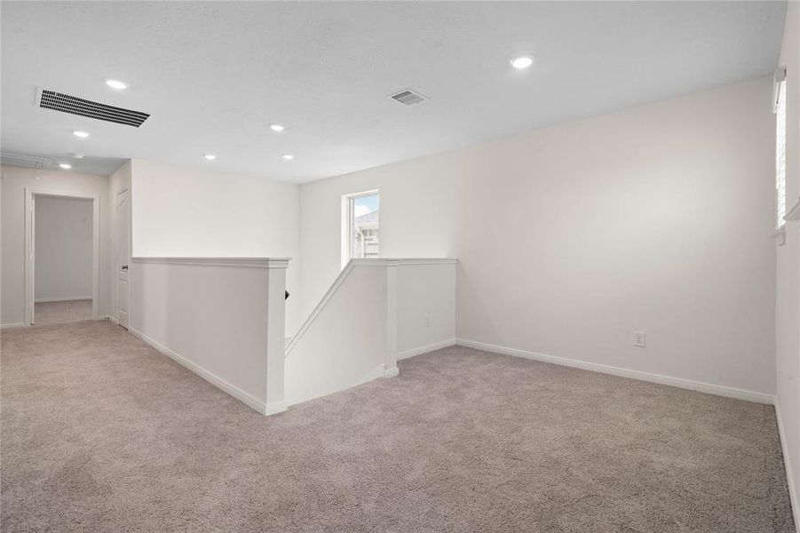 Another view in the game room looking towards the staircase