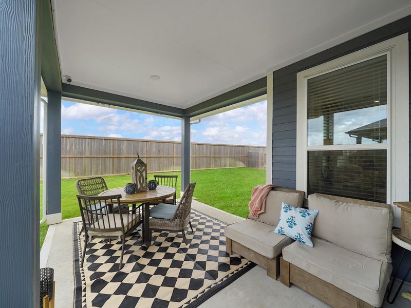 Step outside to a covered patio designed for relaxing evenings or casual outdoor dining, extending your living space outdoors.