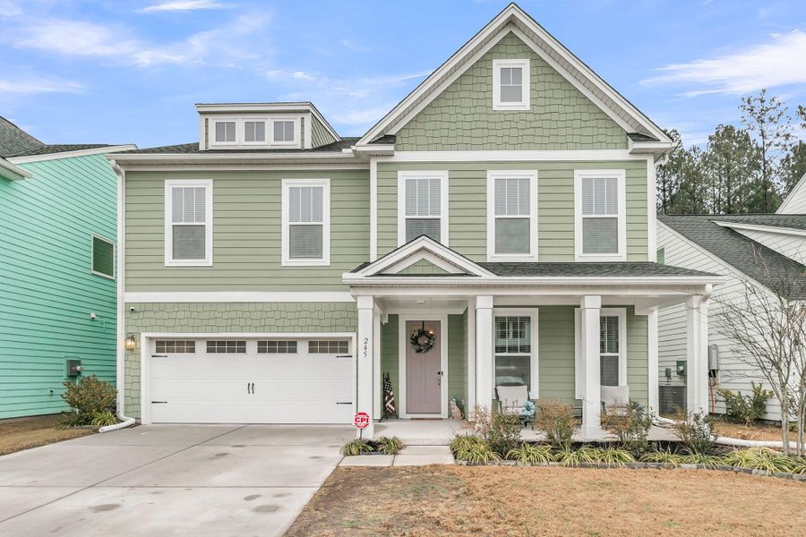 Front exterior of a new home in Homecoming, Ravenel, SC, highlighting curb appeal (Image 26).