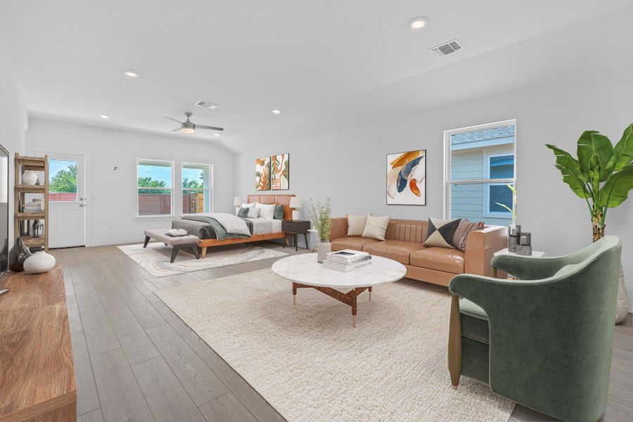 Living room featuring hardwood / wood-style flooring, recessed lighting, and a ceiling fan Living room featuring hardwood / wood-style flooring, recessed lighting, and a ceiling fan