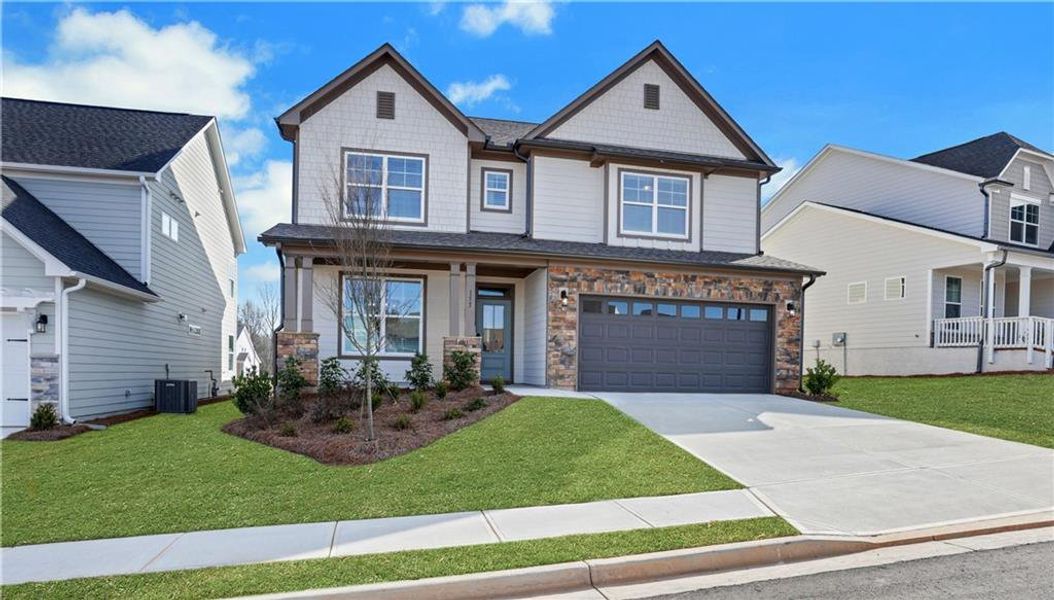 Front exterior of a new home in Twin Lakes, Hoschton, GA, highlighting curb appeal (Image 25).