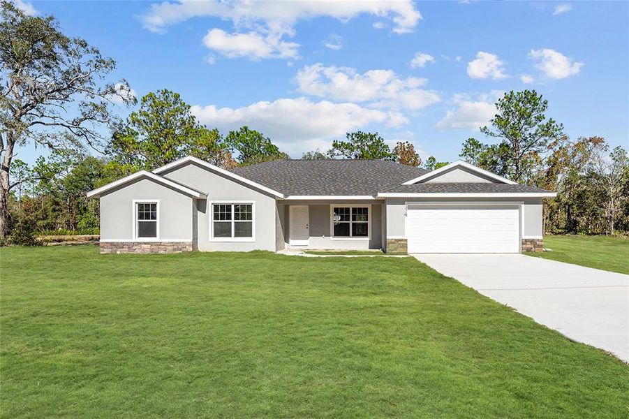 Front exterior of a new home in , Dunnellon, FL, highlighting curb appeal (Image 1). Front exterior of a new home in , Dunnellon, FL, highlighting curb appeal (Image 1).