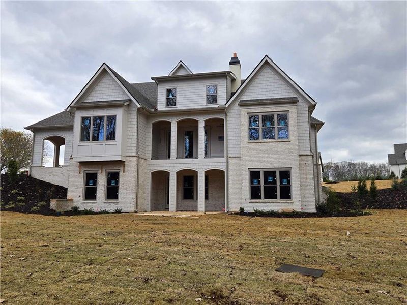 Front exterior of a new home in , Flowery Branch, GA, highlighting curb appeal (Image 10).